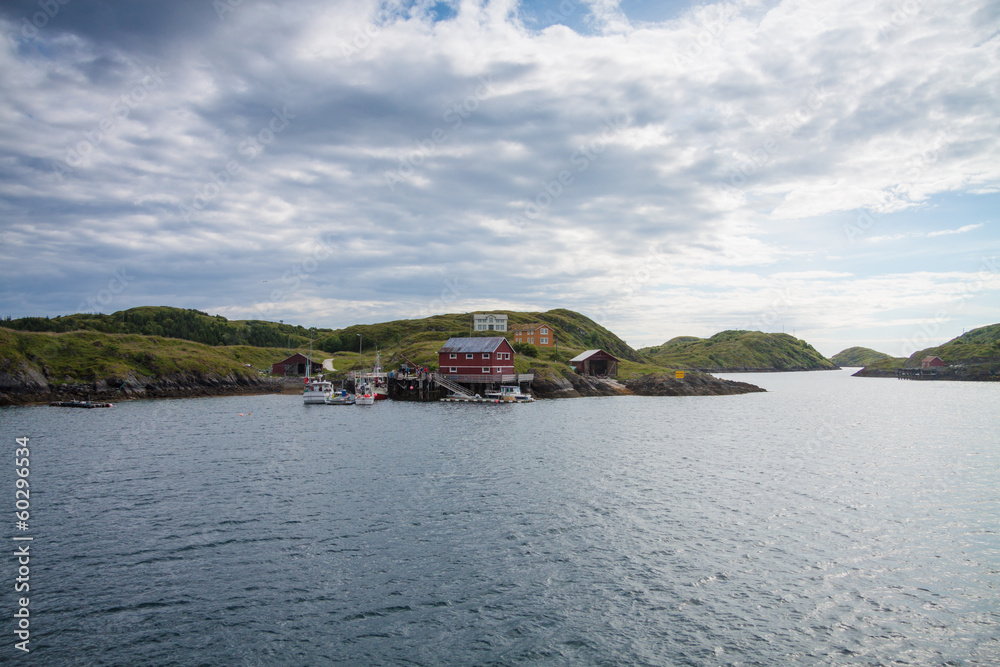 Naklejka premium Houses and small harbor on island in Northern Norway