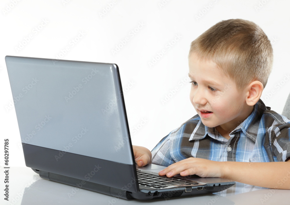 Computer addiction child with laptop notebook Computer addiction child with laptop notebook