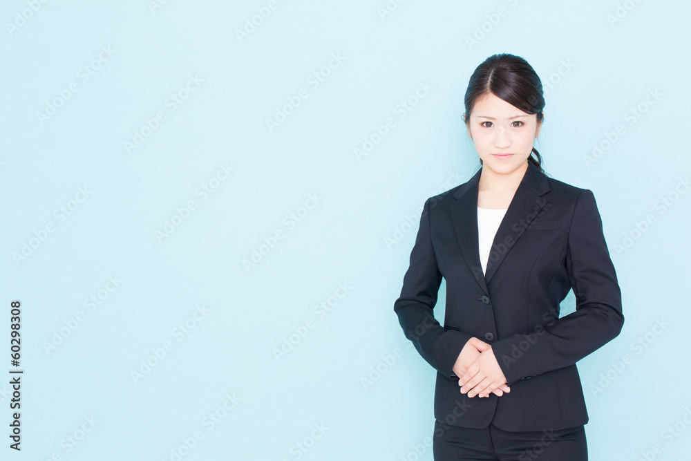 young asian businesswoman on blue background young asian businesswoman on blue background