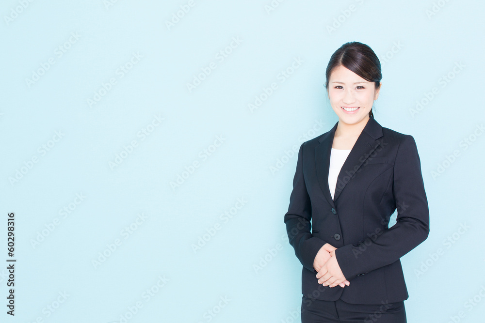 young asian businesswoman on blue background young asian businesswoman on blue background
