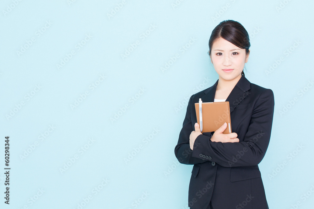 young asian businesswoman on blue background young asian businesswoman on blue background