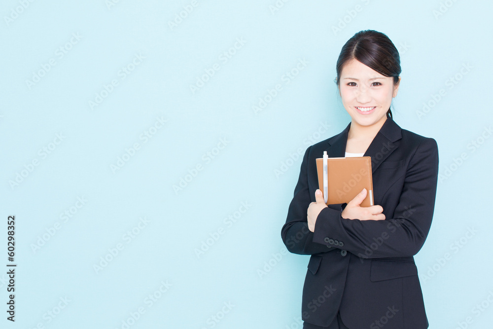 young asian businesswoman on blue background young asian businesswoman on blue background