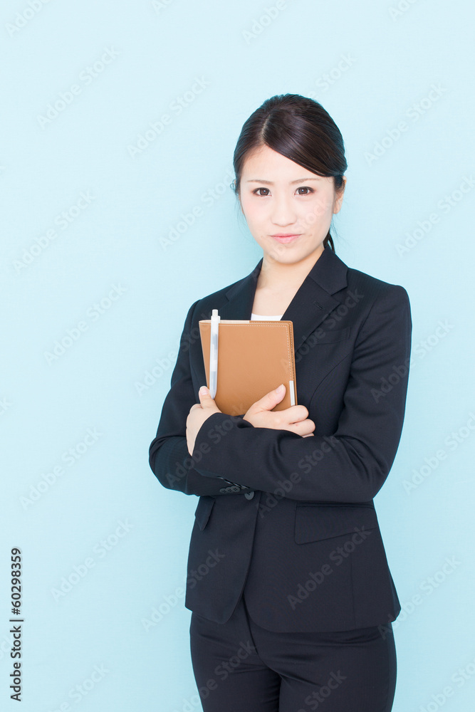 young asian businesswoman on blue background young asian businesswoman on blue background
