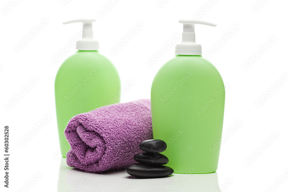 cosmetic containers, towel and spa stones isolated on white cosmetic containers, towel and spa stones isolated on white