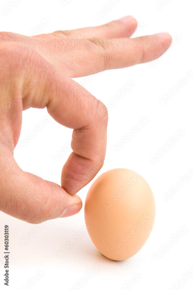 finger kicking an egg with clipping path finger kicking an egg with clipping path
