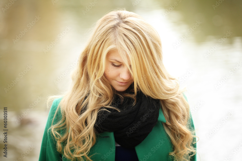 Fototapeta premium face portrait of a beautiful blonde in autumn winter coat