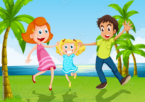 A happy family dancing near the river