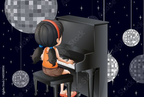 A young girl playing with the piano with disco balls