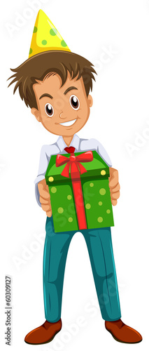 A happy boy holding a gift