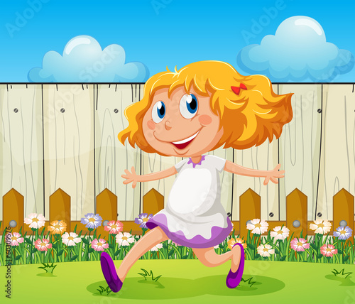 A happy girl playing at the backyard