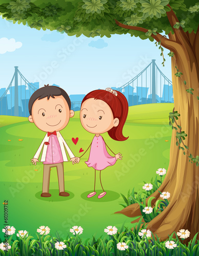 A couple dating near the tree