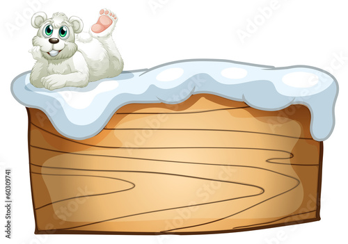 A polar bear above the empty wooden board