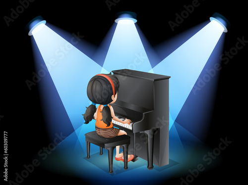 A talented young girl playing with the piano
