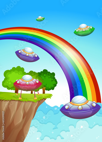 Flying saucers in the sky near the rainbow