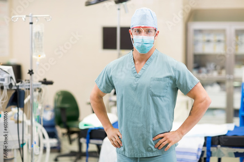 Surgeon With Hands On Hips In Operation Room photo