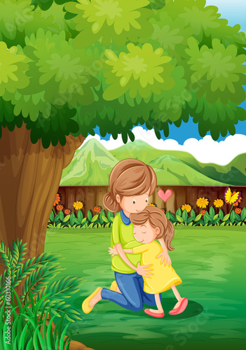 A backyard with a mother and a child