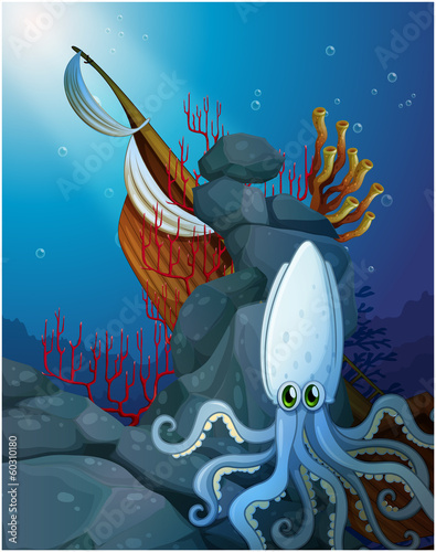 An octopus under the sea near the wrecked ship