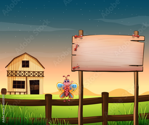 An empty wooden board at the farm with insects