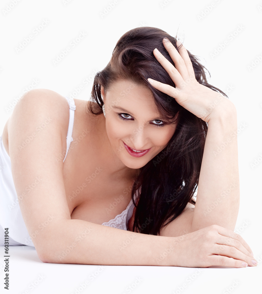 Fototapeta premium Portrait of Young Woman Lying on the Floor Looking