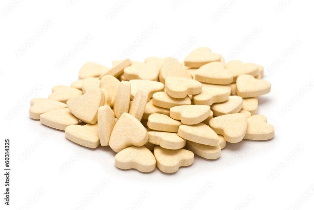 Heap of Heart-shaped tablets isolated on white Heap of Heart-shaped tablets isolated on white
