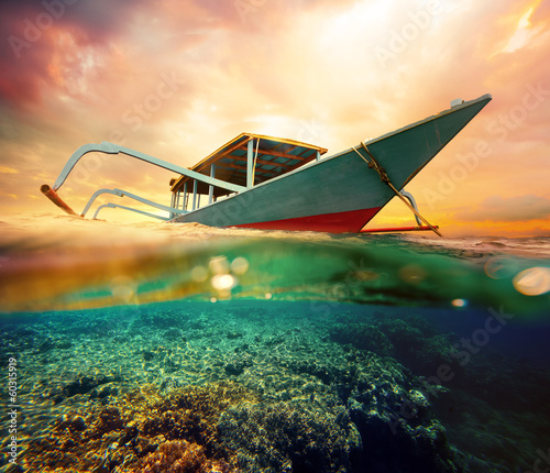 Diving boat at sunset
