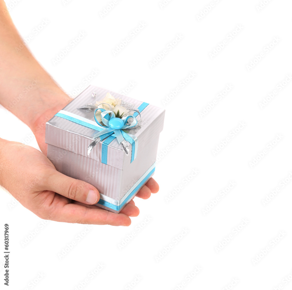 Stylish gift box with blue ribbon in hand.