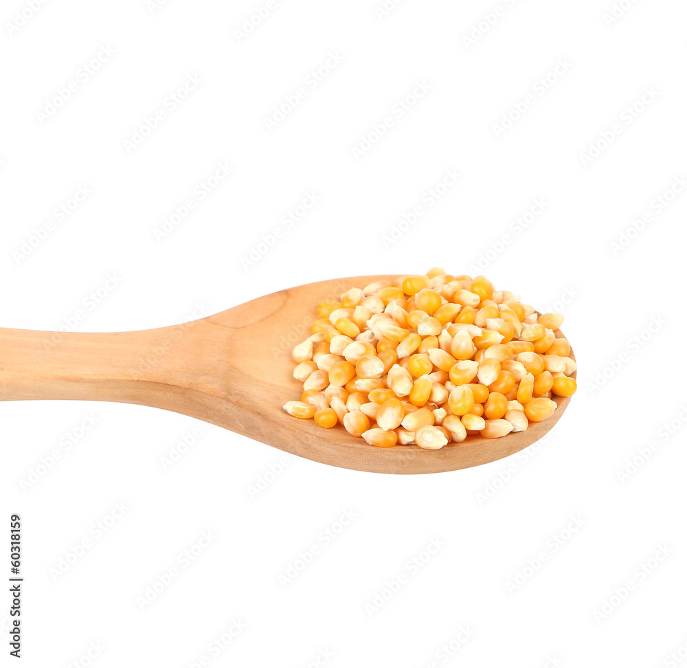 Corn grain in wooden spoon. Corn grain in wooden spoon.