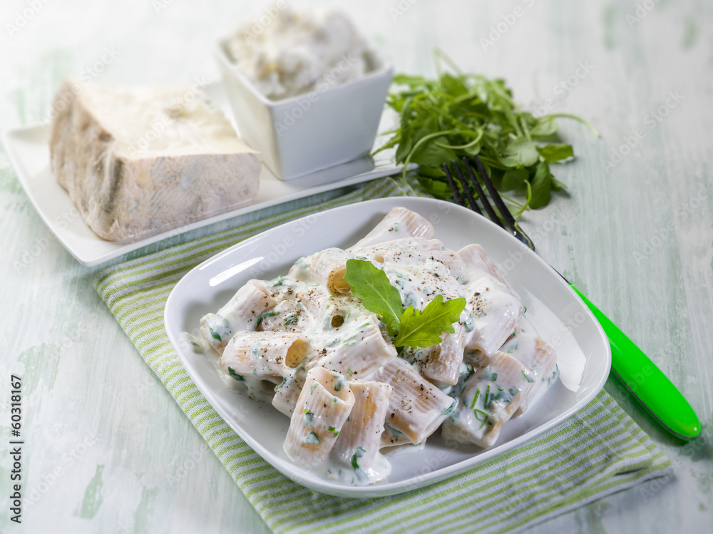 pasta with gorgonzola and arugula, selective focus pasta with gorgonzola and arugula, selective focus