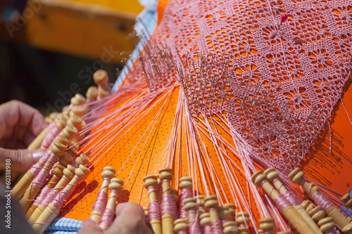 Women`s hands, tatting