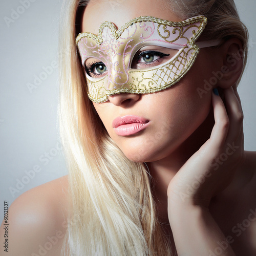 Beautiful Blond Woman in Carnival Mask.Masquerade