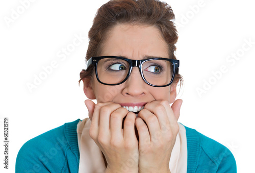 Quadro em tela Stressed, anxious young woman biting fingernails