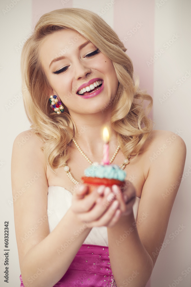 Beautiful retro woman celebrate with blue muffin Beautiful retro woman celebrate with blue muffin