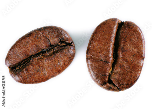 A close-up picture of coffee beans on a white background