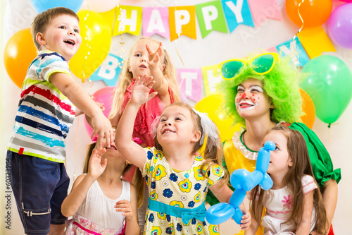 children celebrating .merrily birthday party