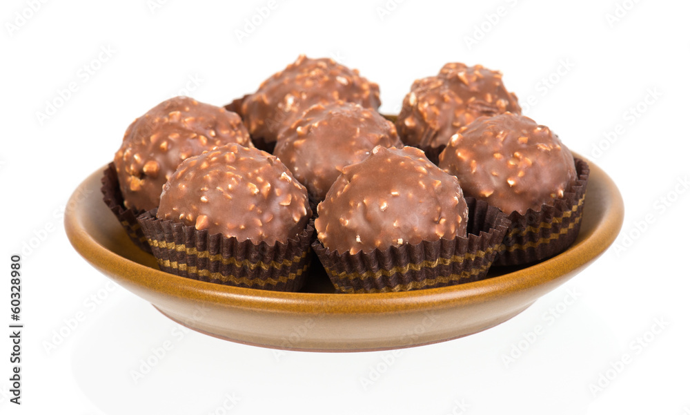 chocolate candy in tartlet form on white chocolate candy in tartlet form on white