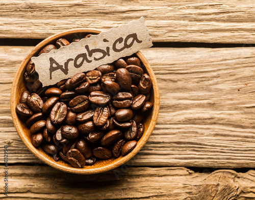 Bowl of Arabica coffee beans photo