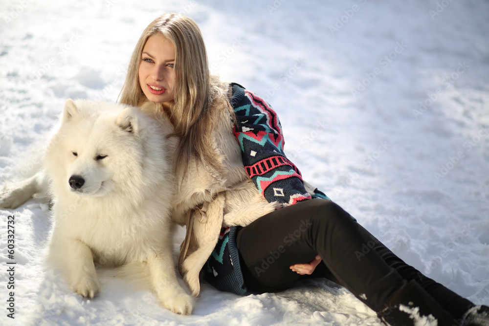 Beautiful young girl with a dog Huskies Beautiful young girl with a dog Huskies