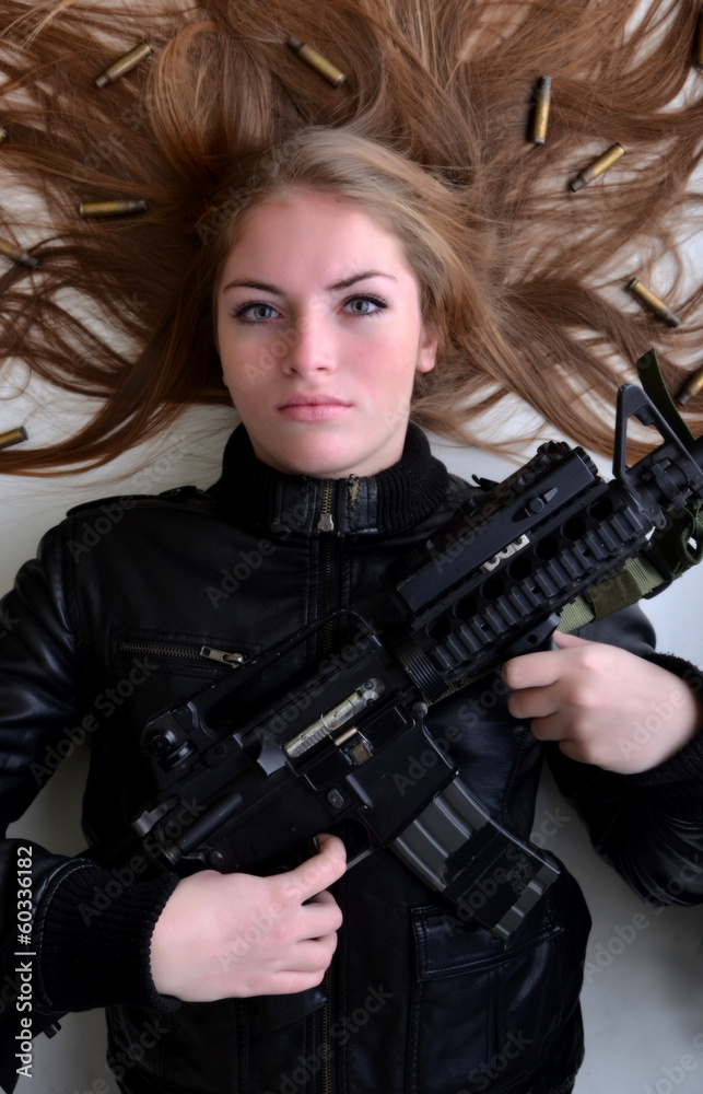 Fototapeta beautiful sexy girl holding gun