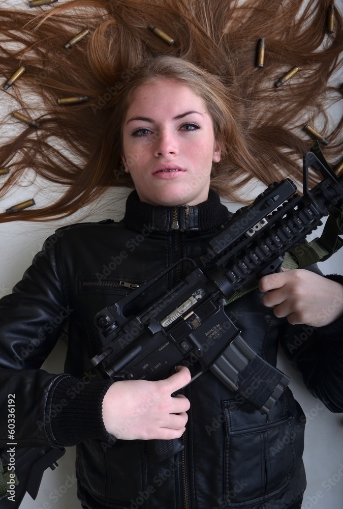 Fototapeta premium beautiful sexy girl holding gun