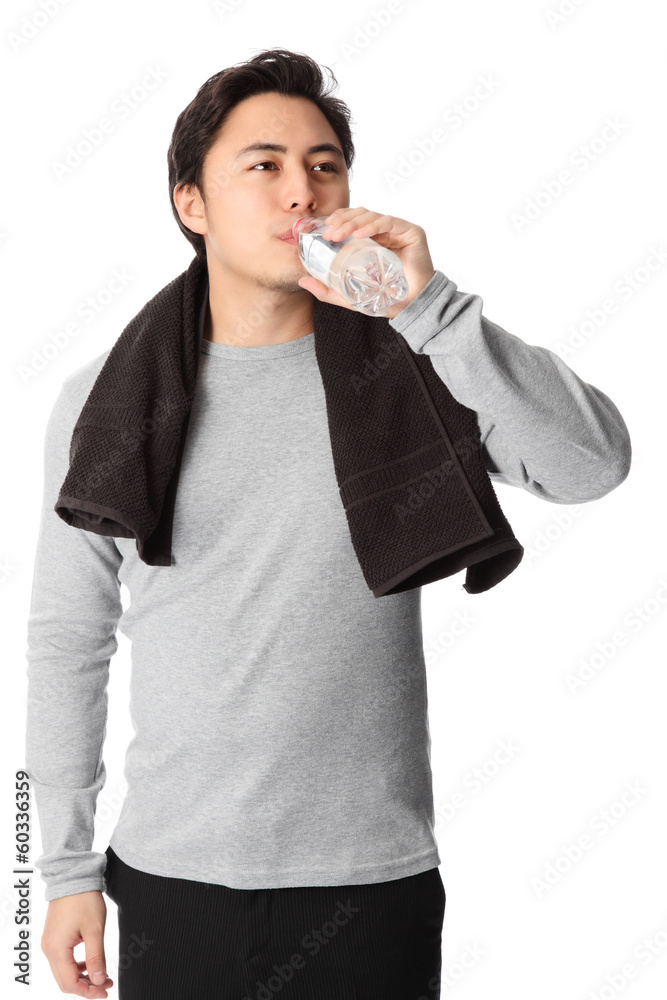Young man drinking water Young man drinking water