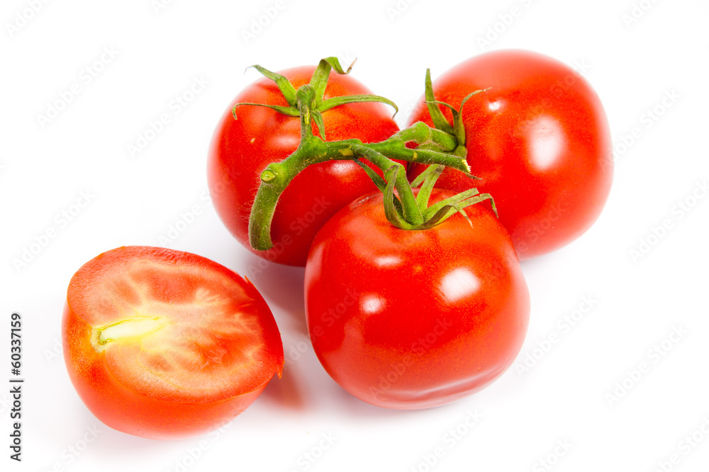 Closeup of tomatoes on the vine isolated on white. Tomato branch Closeup of tomatoes on the vine isolated on white. Tomato branch