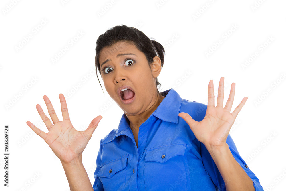 Closeup portrait scared woman raising hands up in defense Closeup portrait scared woman raising hands up in defense