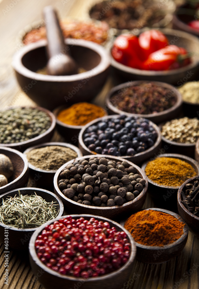 Spices on wooden bowl background 