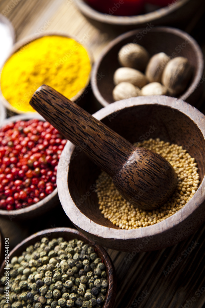 Assortment of spices in wooden bowl background Assortment of spices in wooden bowl background
