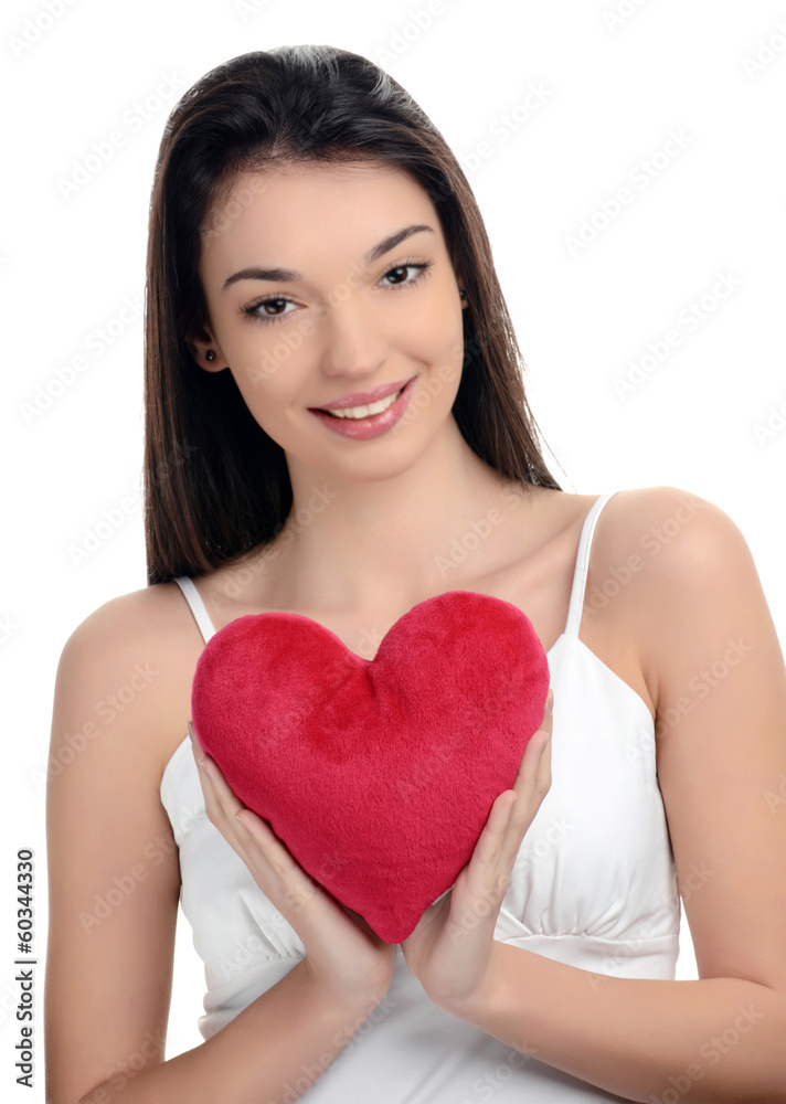 Girl holding a red heart.Valentine day.Focus heart,blur model. Girl holding a red heart.Valentine day.Focus heart,blur model.