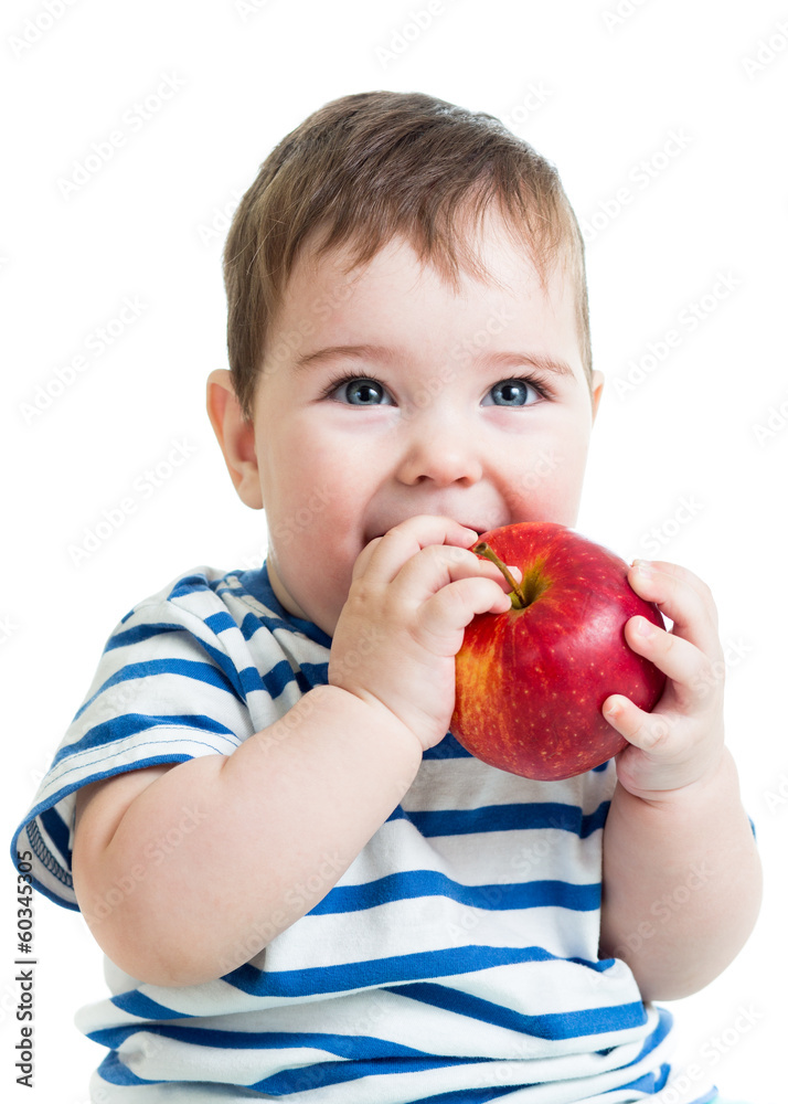 Portrait of baby boy holding and eating red apple, isolated on w Portrait of baby boy holding and eating red apple, isolated on w