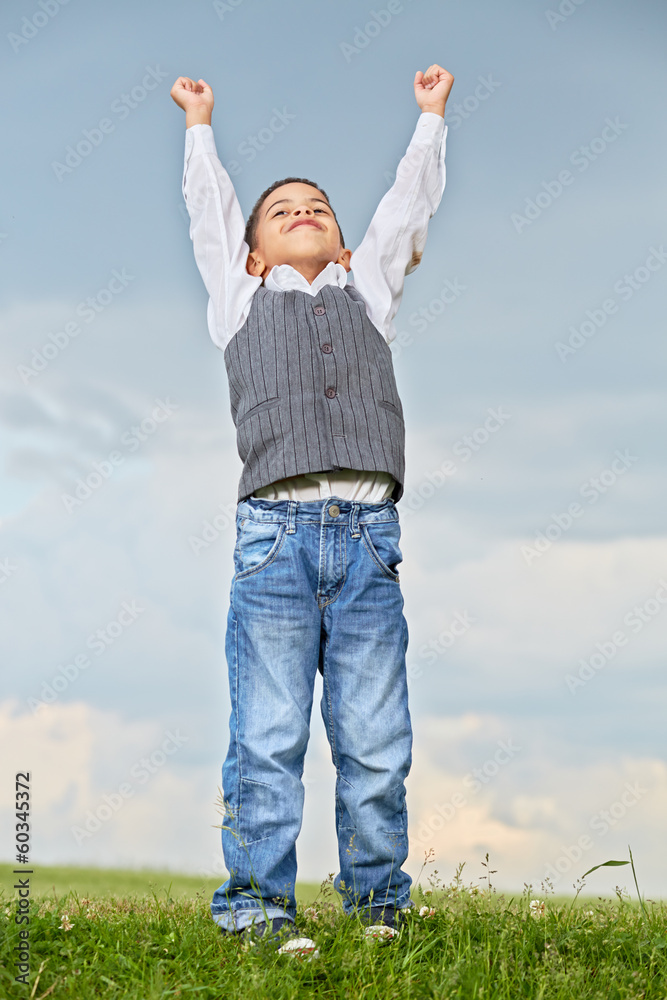 Portrait of boy who stands with raised hands Portrait of boy who stands with raised hands