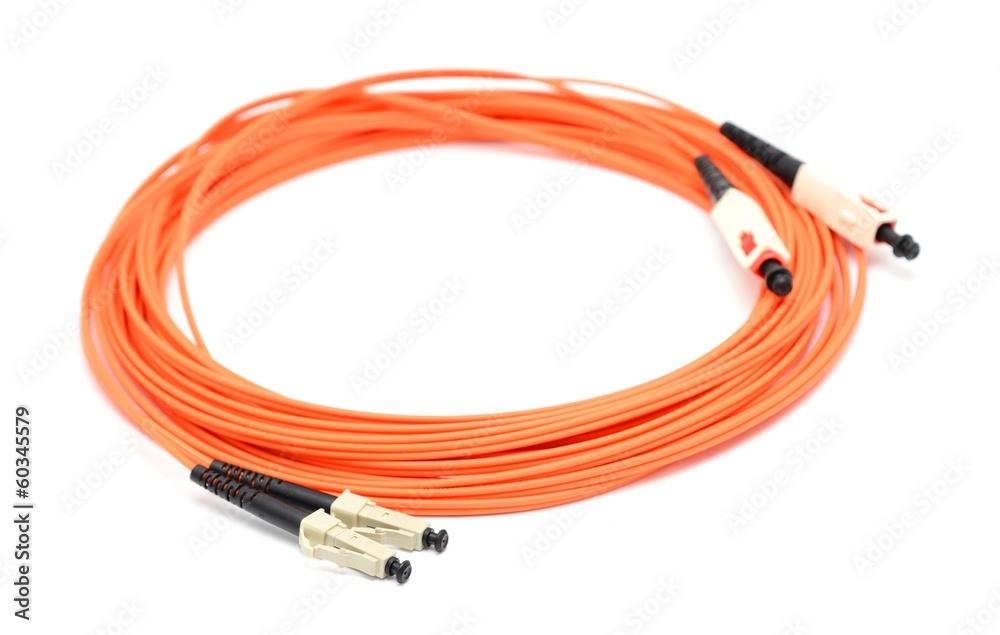 Orange optical cable on the white background macro shot. Orange optical cable on the white background macro shot.