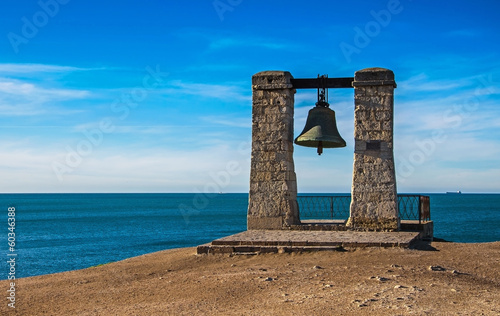 ancient bell against sea