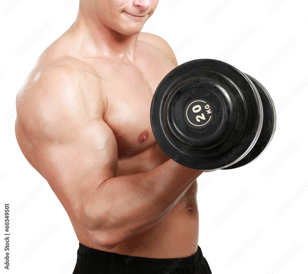 Handsome muscular man working out with dumbbells Handsome muscular man working out with dumbbells